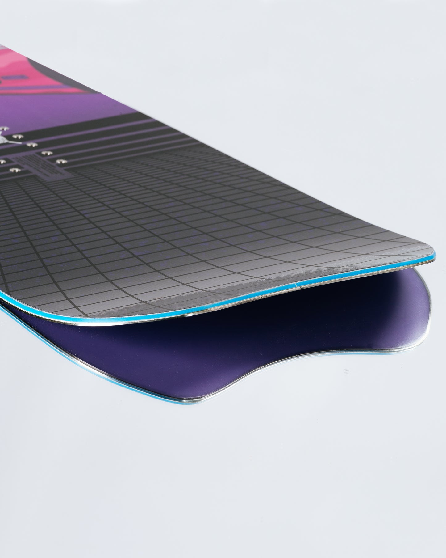 The tail and base of the powder snowboard with PowerSlide Slade. Service Dog 2025 | Rome Snowboards™