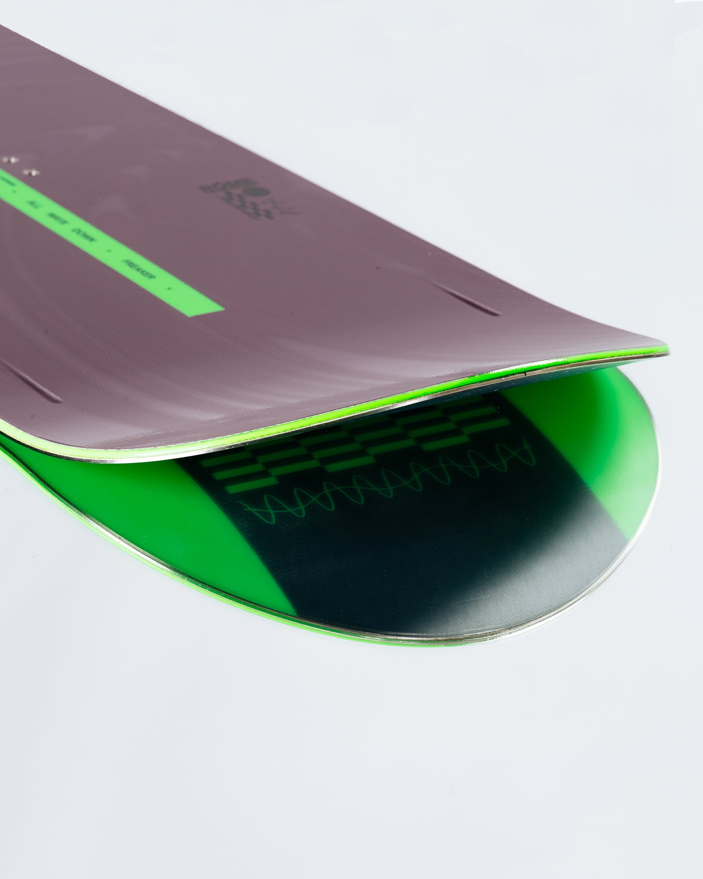 The tail and base of the freeride snowboard with HotRods and SinterStrong base.
 Freaker 2025 | Rome Snowboards™ 2025.