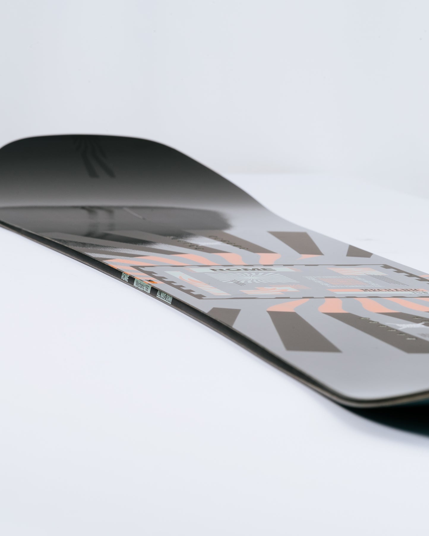 Photograph showing freeride snowboard with contact rocker camber. Mechanic 2025 | Rome Snowboards™