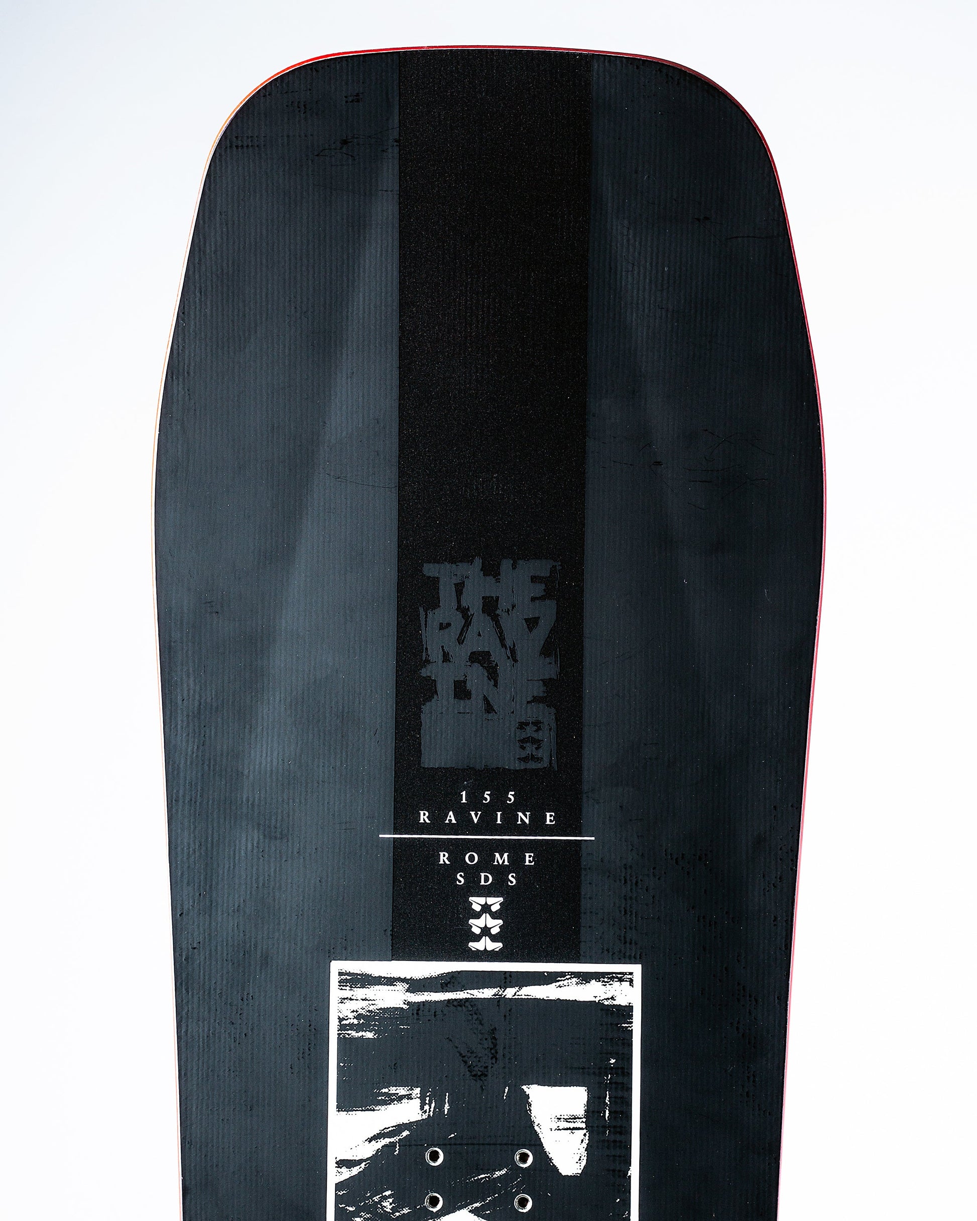 rome sds ravine 2023 directional snowboard product photo close up nose shot in studio